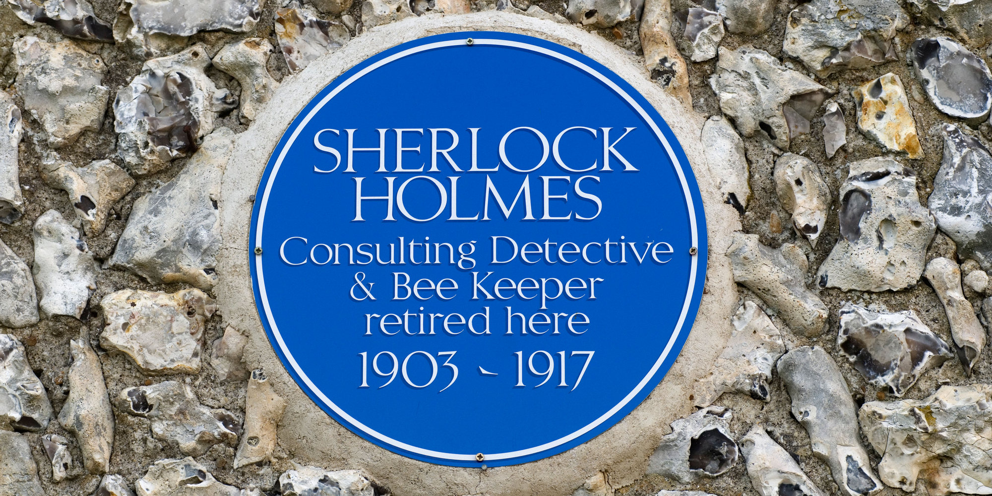 Sherlock Holmes blue plaque East Dean village near Eastbourne East Sussex. UK HOMER SYKES